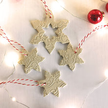 Load image into Gallery viewer, ceramic hanging Christmas tree ornament snowflakes. Pottery hanging snowlake set for holiday home decor.