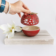 Load image into Gallery viewer, These ceramic bowls with a lid are ideal to use as a vanity jar to keep small valuables safe in the bathroom or bedroom. Ceramic bowls are made from white clay with gold-painted accents and hand-carved cut-outs in the lid.

