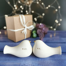 Load image into Gallery viewer, This pair of beautiful wedding cake toppers will add a classy finishing touch to your cake! The elegant cake toppers represent a pair of love birds or white doves. These cake toppers will decorate not only your wedding cake but also your home.