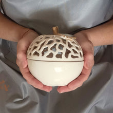 Load image into Gallery viewer, These ceramic bowls with a lid are ideal to use as a vanity jar to keep small valuables safe in the bathroom or bedroom. Ceramic bowls are made from white clay with gold-painted accents and hand-carved cut-outs in the lid.