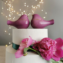 Load image into Gallery viewer, This pair of beautiful wedding cake toppers will add a classy finishing touch to your cake! The elegant cake toppers represent a pair of love birds or white doves. These cake toppers will decorate not only your wedding cake but also your home.