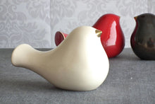 Load image into Gallery viewer, Ceramic bird with a gold beak. This skillfully crafted ceramic bird will look great perched on a shelf, cabinet, or desk. A great statement piece of décor, this ceramic bird will also make a romantic table centerpiece for weddings and other occasions.
