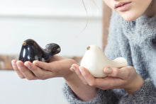 Load image into Gallery viewer, Ceramic bird with a gold beak. This skillfully crafted ceramic bird will look great perched on a shelf, cabinet, or desk. A great statement piece of décor, this ceramic bird will also make a romantic table centerpiece for weddings and other occasions.