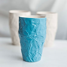 Load image into Gallery viewer, Upgrade your drinkware with these crumpled ceramic tumblers! The tumblers are made from high-quality white clay with a fascinating texture. This ceramic tumbler is perfect for drinking cold beverages like juice, water, milk, soft drinks, and even wine!