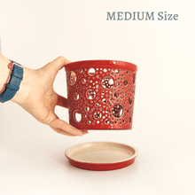 Load image into Gallery viewer, Keep your orchids or other house plants happy in an attractive carved ceramic orchid planter! Each one has carved patterns to allow for aeration of the soil inside the container. You could use this ceramic planter as a fruit bowl or candle holder.