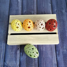 Load image into Gallery viewer, Add all the colors of spring to your home with these gorgeous Easter eggs! These carved ceramic eggs make beautiful spring decorations. Use them as Easter table decor or place them on a shelf or countertop as a springtime accent piece.