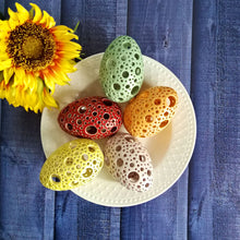 Load image into Gallery viewer, Add all the colors of spring to your home with these gorgeous Easter eggs! These carved ceramic eggs make beautiful spring decorations. Use them as Easter table decor or place them on a shelf or countertop as a springtime accent piece.