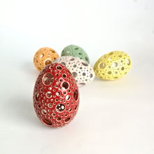 Load image into Gallery viewer, Add all the colors of spring to your home with these gorgeous Easter eggs! These carved ceramic eggs make beautiful spring decorations. Use them as Easter table decor or place them on a shelf or countertop as a springtime accent piece.
