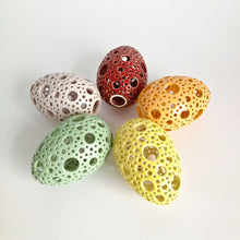 Load image into Gallery viewer, Add all the colors of spring to your home with these gorgeous Easter eggs! These carved ceramic eggs make beautiful spring decorations. Use them as Easter table decor or place them on a shelf or countertop as a springtime accent piece.