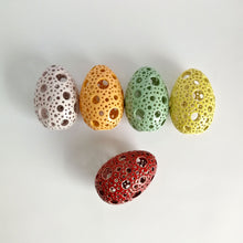 Load image into Gallery viewer, Add all the colors of spring to your home with these gorgeous Easter eggs! These carved ceramic eggs make beautiful spring decorations. Use them as Easter table decor or place them on a shelf or countertop as a springtime accent piece.