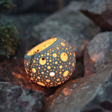 Load image into Gallery viewer, Enjoy this pot as either a planter or a hanging candle holder - the choice is yours! The detailed designs are carved by hand into the pottery and either allow air to circulate to your plant or cast fascinating patterns if you use it as a candle holder!