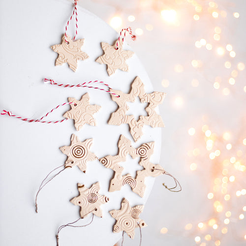 ceramic hanging Christmas tree ornament snowflakes. Pottery hanging snowlake set for holiday home decor.