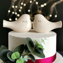 Load image into Gallery viewer, This pair of beautiful wedding cake toppers will add a classy finishing touch to your cake! The elegant cake toppers represent a pair of love birds or white doves. These cake toppers will decorate not only your wedding cake but also your home.

