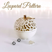 Load image into Gallery viewer, These ceramic bowls with a lid are ideal to use as a vanity jar to keep small valuables safe in the bathroom or bedroom. Ceramic bowls are made from white clay with gold-painted accents and hand-carved cut-outs in the lid.
