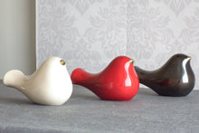 Load image into Gallery viewer, Ceramic bird with a gold beak. This skillfully crafted ceramic bird will look great perched on a shelf, cabinet, or desk. A great statement piece of décor, this ceramic bird will also make a romantic table centerpiece for weddings and other occasions.
