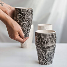 Load image into Gallery viewer, Upgrade your drinkware with these crumpled ceramic tumblers! The tumblers are made from high-quality white clay with a fascinating texture. This ceramic tumbler is perfect for drinking cold beverages like juice, water, milk, soft drinks, and even wine!
