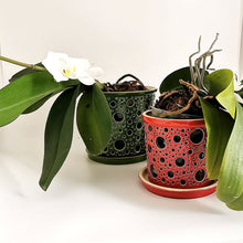 Load image into Gallery viewer, Keep your orchids or other house plants happy in an attractive carved ceramic orchid planter! Each one has carved patterns to allow for aeration of the soil inside the container. You could use this ceramic planter as a fruit bowl or candle holder. 
