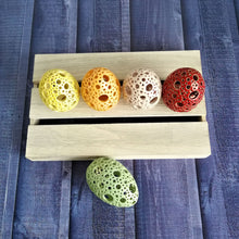 Load image into Gallery viewer, Add all the colors of spring to your home with these gorgeous Easter eggs! These carved ceramic eggs make beautiful spring decorations. Use them as Easter table decor or place them on a shelf or countertop as a springtime accent piece.
