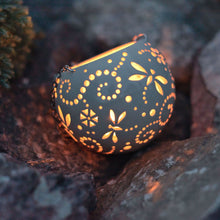Load image into Gallery viewer, Enjoy this pot as either a planter or a hanging candle holder - the choice is yours! The detailed designs are carved by hand into the pottery and either allow air to circulate to your plant or cast fascinating patterns if you use it as a candle holder!
