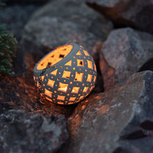 Load image into Gallery viewer, Enjoy this pot as either a planter or a hanging candle holder - the choice is yours! The detailed designs are carved by hand into the pottery and either allow air to circulate to your plant or cast fascinating patterns if you use it as a candle holder!
