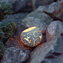 Load image into Gallery viewer, Enjoy this pot as either a planter or a hanging candle holder - the choice is yours! The detailed designs are carved by hand into the pottery and either allow air to circulate to your plant or cast fascinating patterns if you use it as a candle holder!
