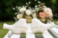 Load image into Gallery viewer, This pair of beautiful wedding cake toppers will add a classy finishing touch to your cake! The elegant cake toppers represent a pair of love birds or white doves. These cake toppers will decorate not only your wedding cake but also your home.
